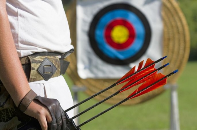  archer in front of a target 